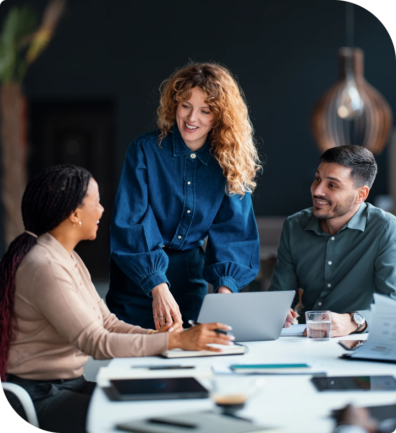 Group collaboration in modern office setting.