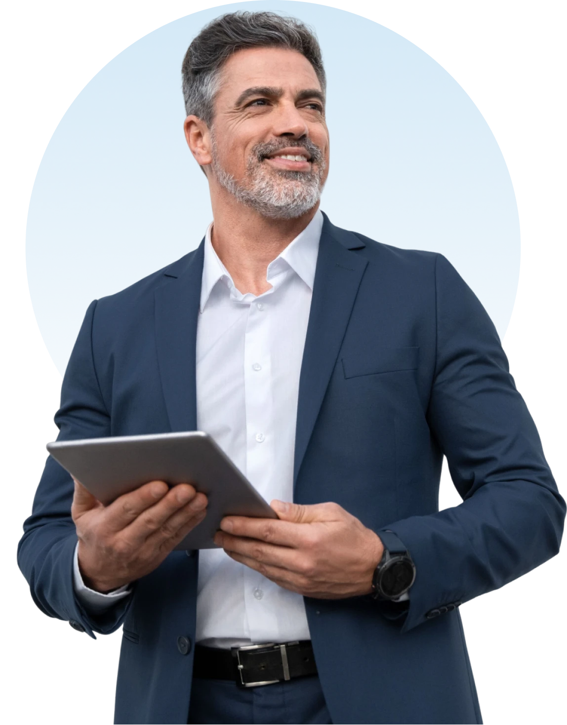 Man in suit holding tablet, smiling confidently.