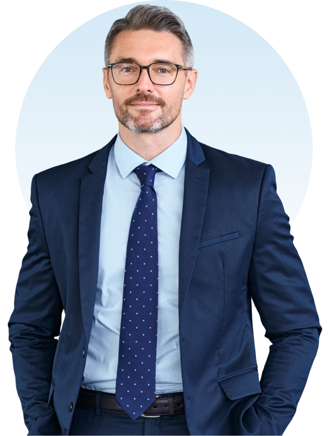Man in navy suit with glasses.